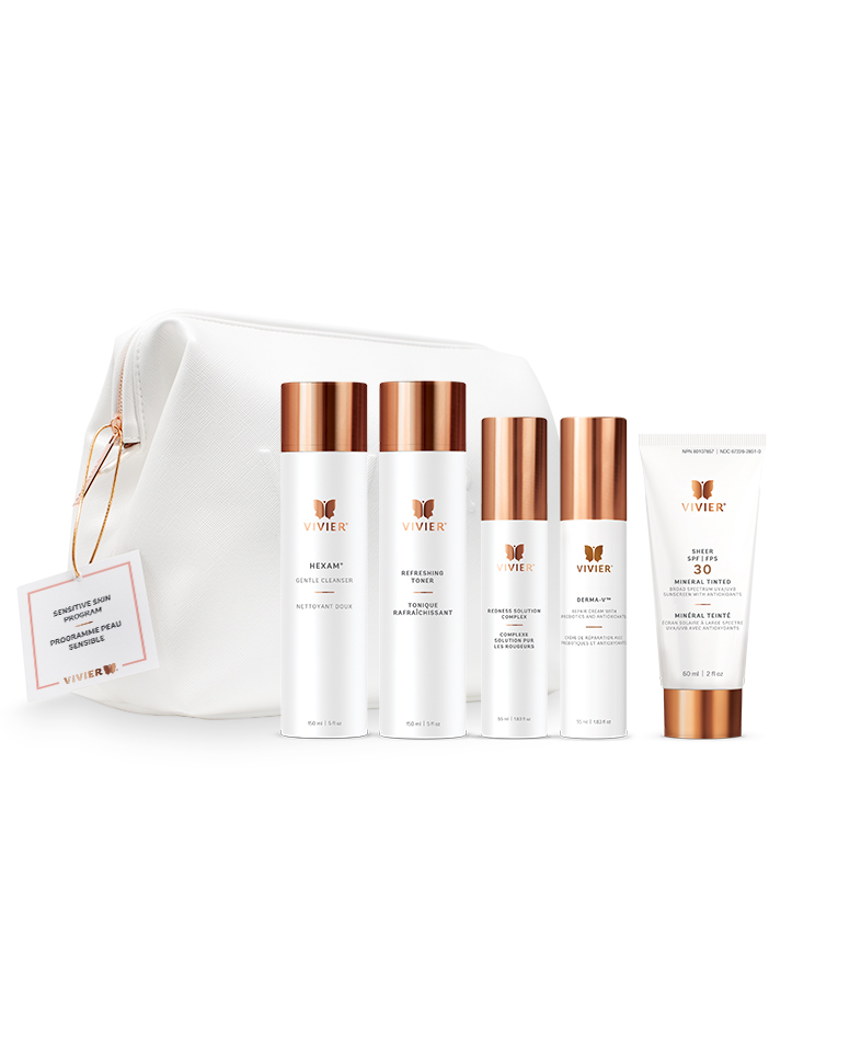 7 Vivier Skincare Programs That Target Dryness, Dark Spots, Aging & More A line of gold and white skincare products positioned in front of a white leather bag on a white backdrop.